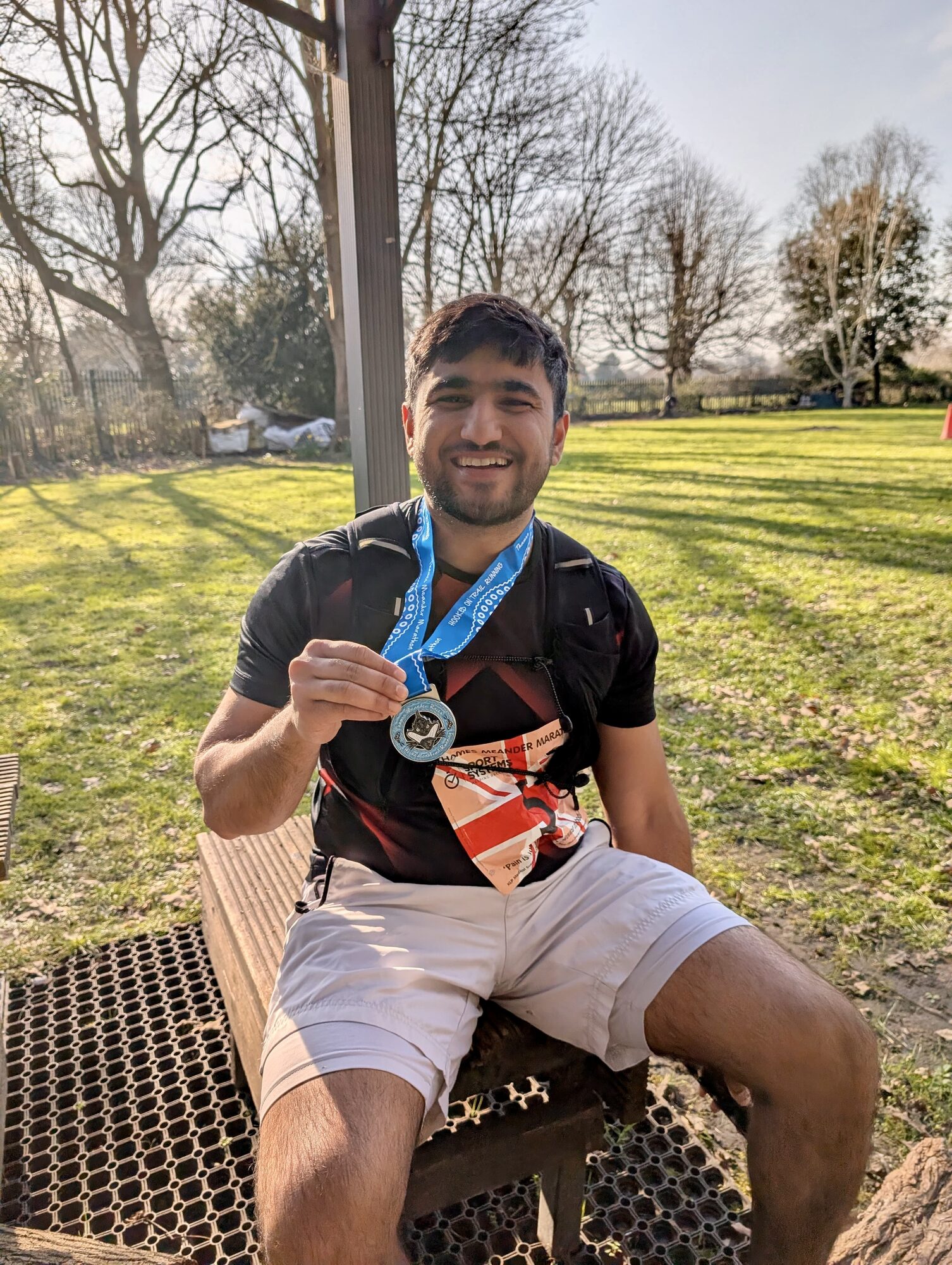 Anuj with his Thames Meander Marathon finisher medal.