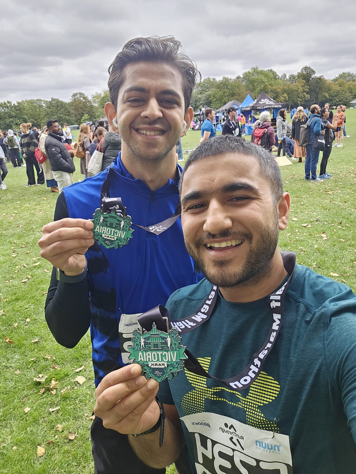 Coach Anuj with a marathon finisher medal